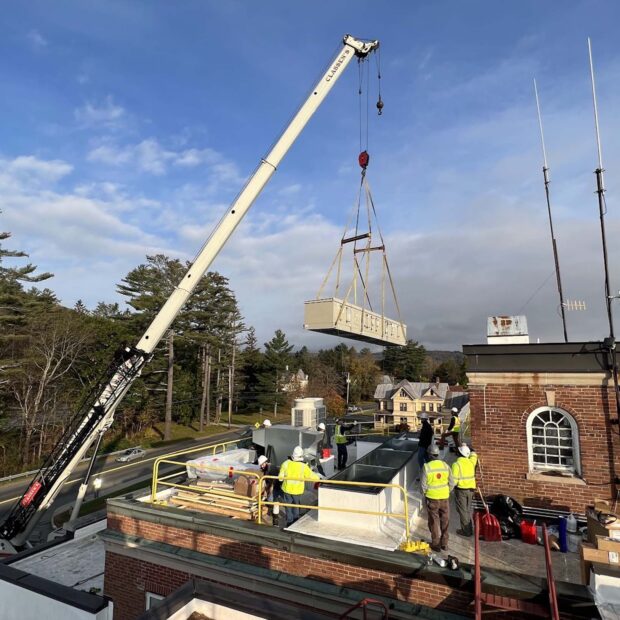 crew installing new ER air handling system on Gifford Health Care rooftop